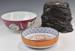 Chinese pedestal bowl, Japanese shallow dish and a large carved wooden stand, tallest 20cm