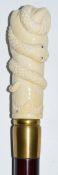 Walking stick / cane with carved bone clenched fist and serpent handle