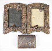 Pair of Japanese 19th / 20thC bronze photograph frames with relief moulded dragon decoration, 21 x