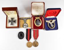 Replica / copy WW2 German badges including pilot's badge, Iron Cross, Deaths Head badge and