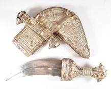 Omani Khanjar dagger with decorated waisted hilt and scabbard and 17cm blade. By repute a gift