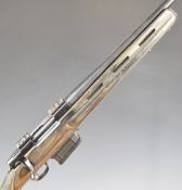 Howa Model 1500 Custom .243 bolt-action rifle with laminated show wood stock, semi-pistol grip,