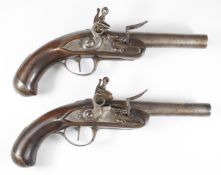 A pair of Queen Anne style flintlock coat pistols, each with steel trigger guard, butt cap and mount