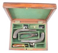 A pair of Williams & Powell of Liverpool percussion hammer action muff pistols, each with named