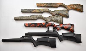 Six Nikko Stirling and Hawke stock blanks in various camouflage and similar finishes.