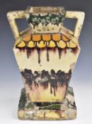 E Simonot Art Deco large twin handled drip glazed pottery pedestal vase, height 45cm