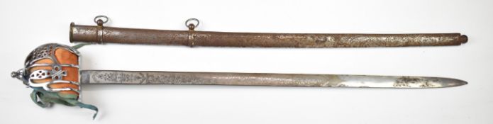 Scottish or similar broadsword with basket hilt and etched 85.5cm blade, in two band scabbard.