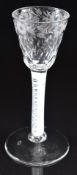 An 18thC cordial drinking glass with cotton twist stem and etched and cut glass bowl, 14.5cm tall.