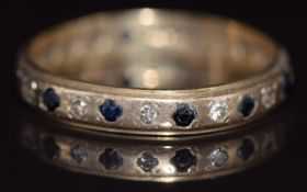 A 9ct gold eternity ring set with alternating sapphires and diamonds, 1.8g, size O