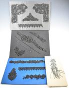 Collection of mounted beadwork samples and remnants including Art Deco examples