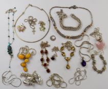 Seventeen silver necklaces / pendants including amber, opal, agate, etc