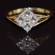 An 18ct gold ring set with four princess cut diamonds, the total diamond weight approximately 0.8ct,