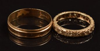A 9ct gold wedding band / ring and a 9ct gold eternity ring set with spinel, 4.9g, size P & Z