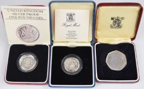 Three Royal Mint proof coins comprising silver proof 1983 UK £1, silver proof 1986 Northern