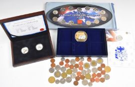 A collection of Canadian coinage comprising a Canada Millennium coin set, 2012 and 2013 Christmas $