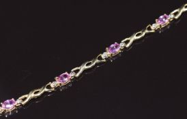 A 14k gold bracelet set with pink sapphires and diamonds, 4.8g 18.5cm