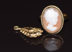 A 9ct gold ring set with a cameo (size M) and a Victorian 9ct gold charm, 3.4g