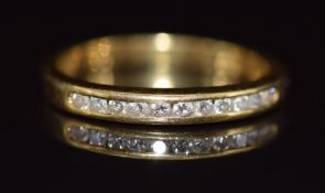 An 18k gold half eternity ring set with diamonds, 2.5g, size K