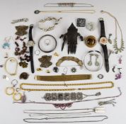 A collection of jewellery including silver bangle, cut steel buckle, silver ingot pendant, gold