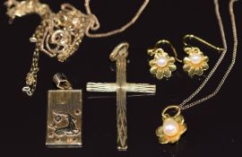 A 9ct gold pendant set with a pearl on 9ct gold chain with matching earrings, a 9ct gold cross and