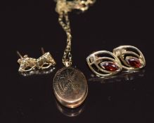 A 9ct gold locket, 9ct gold chain and two pairs of 9ct gold earrings, one pair set with a garnet,