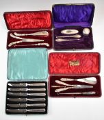 Cased hallmarked silver handled items comprising three dressing table sets and a set of knives,
