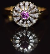 An 18ct gold ring set with a ruby and diamonds, 3.5g, size I