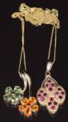 Two 9ct gold pendants, one set with yellow and green sapphires in the form of two flowers and the