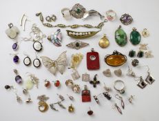 A collection of silver jewellery including earrings, brooches, rings, pendants, etc
