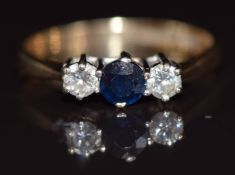 A 9ct gold ring set with a sapphire and diamonds, 1.4g, size J
