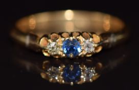 A c1920 18ct gold ring set with a sapphire and diamonds, 2.7g, size N