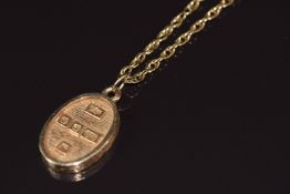 A 9ct gold pendant reading 'Gold' on 9ct gold chain, 15.1g