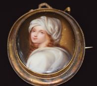 Victorian yellow metal brooch set with a porcelain plaque depicting Beatrice Cenci 24.3g 6.4x5.3cm