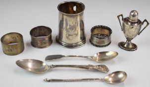 Hallmarked silver items comprising tankard body, three napkin rings, two spoons and a pepper,