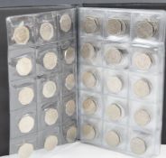 A collection of collectable 50p pieces contained in an album includes Olympic, military, Beatrix