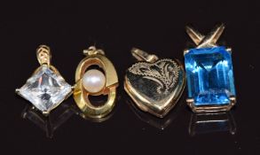 Three 9ct gold pendants, one set with a pearl and one with topaz, the other a locket (9.8g) and a