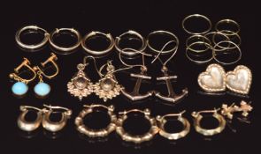 Thirteen pairs of 9ct gold earrings including hoops, anchors, heart, etc, 7.1g