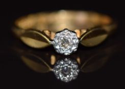 An 18ct gold ring set with a diamond in a platinum setting, 2.5g, size K