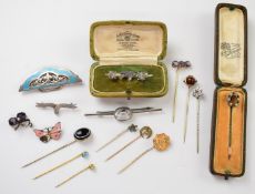 A collection of stick pins including with banded agate, turquoise, paste and amethysts, three silver