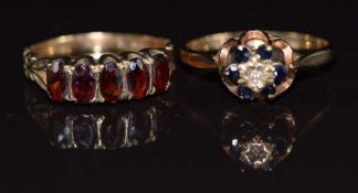 A 9ct gold ring set with a diamond and sapphires and a 9ct gold ring set with garnets, 4.3g, size