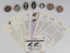 Seven coins comprising four various Westminster and other silver commemorative coins including proof