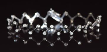 An 18k white gold bracelet set with diamonds in a zig zag design,10.4g 19cm