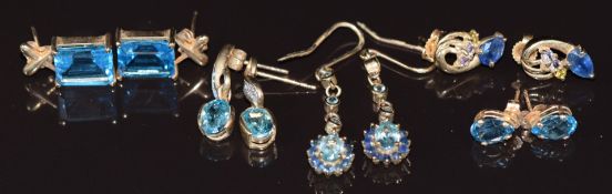Five pairs of 9ct gold earrings set with topaz, and one pair set with sapphires, 12.1g