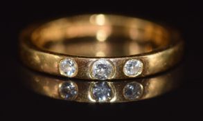 A 22ct gold wedding band / ring set with three diamonds, 4.8g, size M