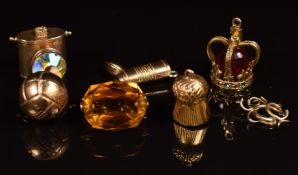 Six 9ct gold charms including football, boot, swivel fob, lantern, crown and thistle, 18g