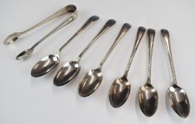 George V hallmarked silver set of six teaspoons and sugar nips with beaded edge decoration,