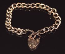 A 9ct rose gold curb link bracelet with engraved links and 9ct gold heart padlock clasp, 9.7g 25cm