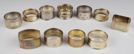 Eleven various hallmarked silver napkin rings to include feature hallmarked, Walker and Hall and