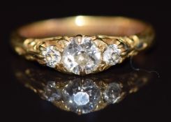 Edwardian 18ct gold ring set with a diamond of approximately 0.3ct and two smaller diamonds, 2.5g,