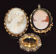 Two 9ct gold brooches set with a cameo to each and a Victorian brooch set with a citrine with